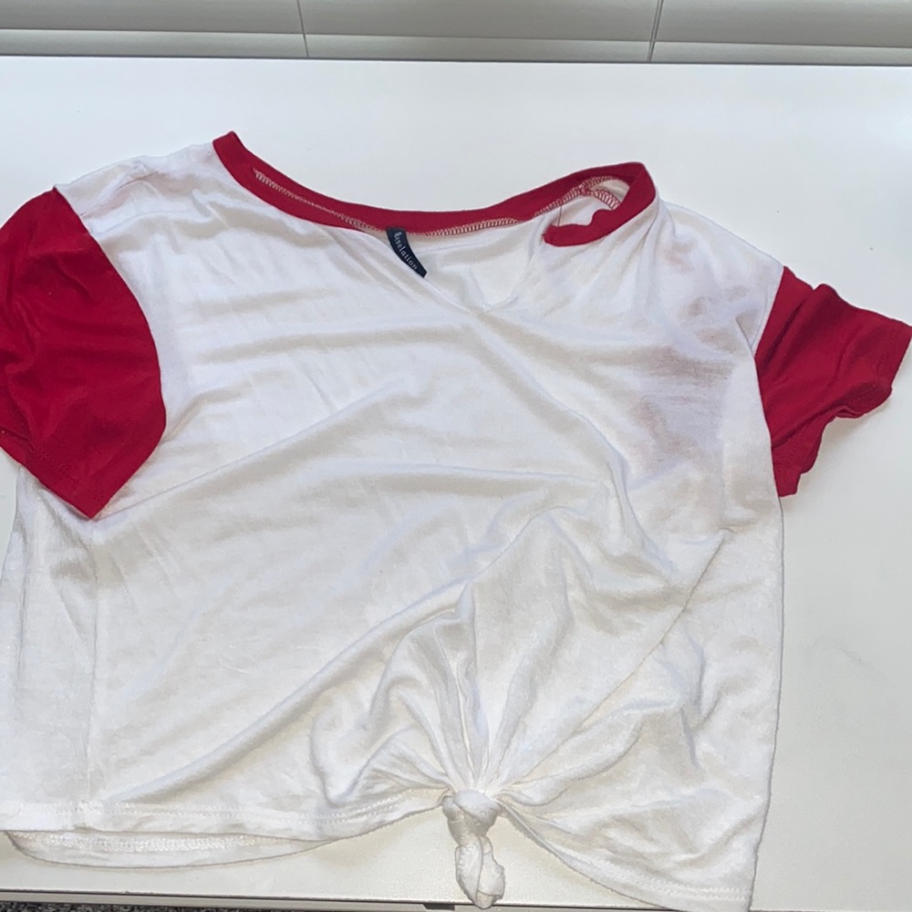 White top with red accents